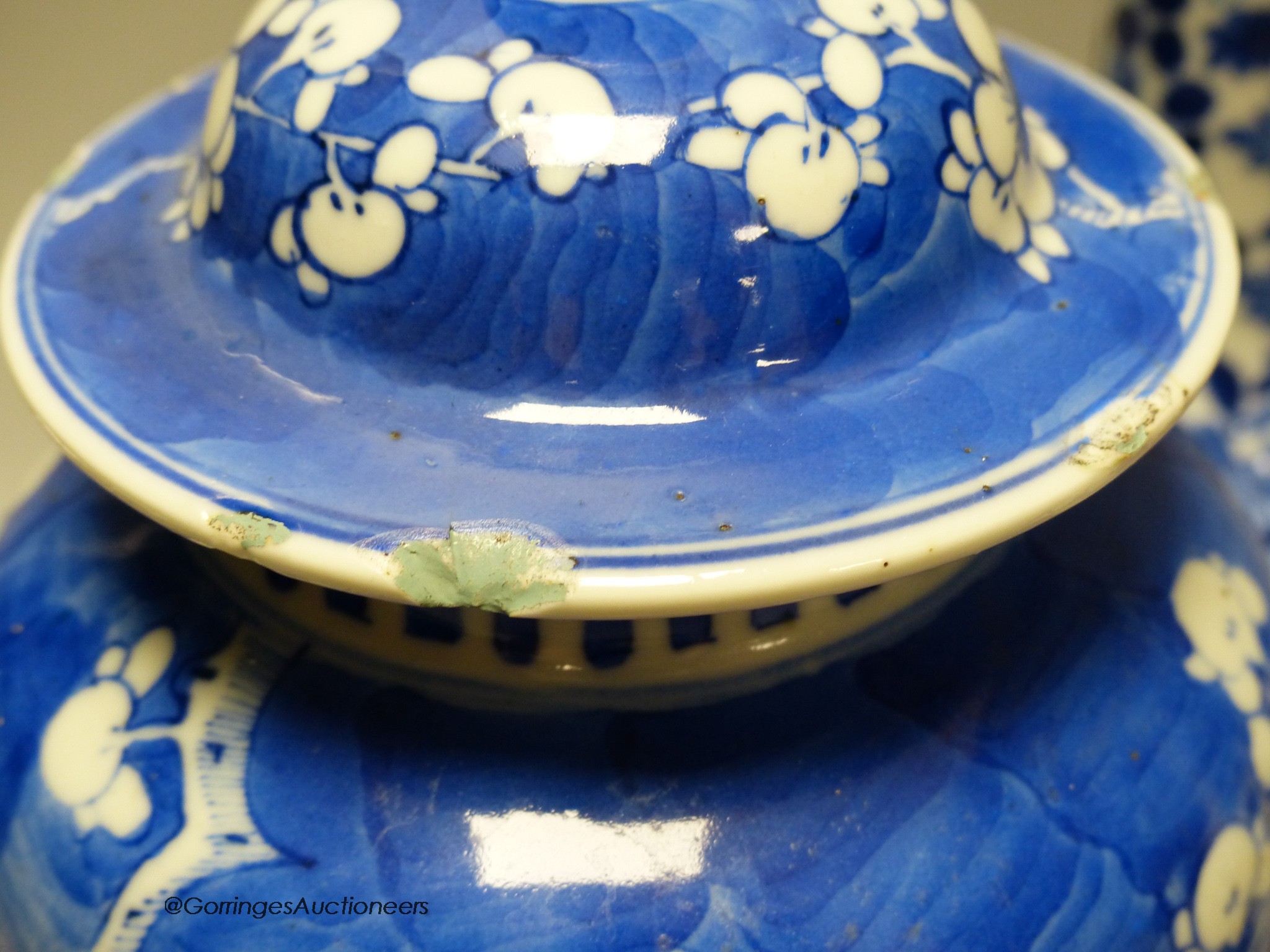 A pair of Chinese blue and white 'dragon' bottle vases, a prunus jar and cover, all late 19th century